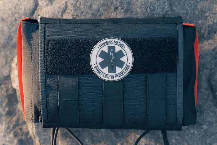FlareSyn vehicle first aid kit neatly organized in a car trunk for emergency preparedness