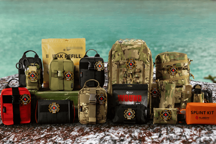 Hiker carrying a bleeding control kit for hiking on a mountain trail with forest background